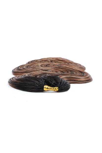 Detail of the ends of t natural black root mixed 4/27/30 body wave feather crochet human hair