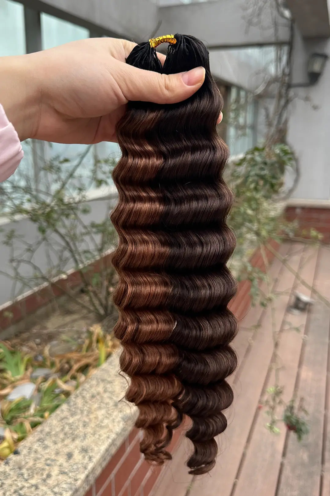 Outdoor picture of T natural black root piano color #4/#30 deep wave feather crochet human hair