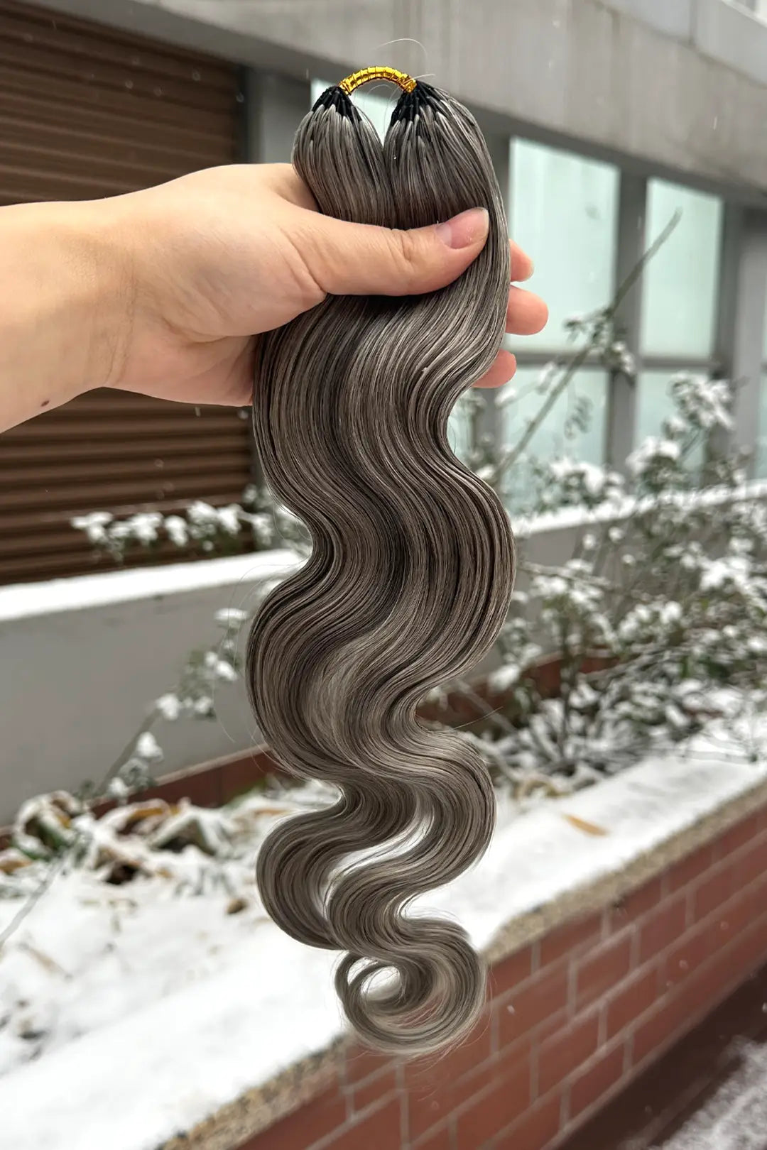 Outdoor picture of salt and pepper body wave feather crochet human hair 85 gray